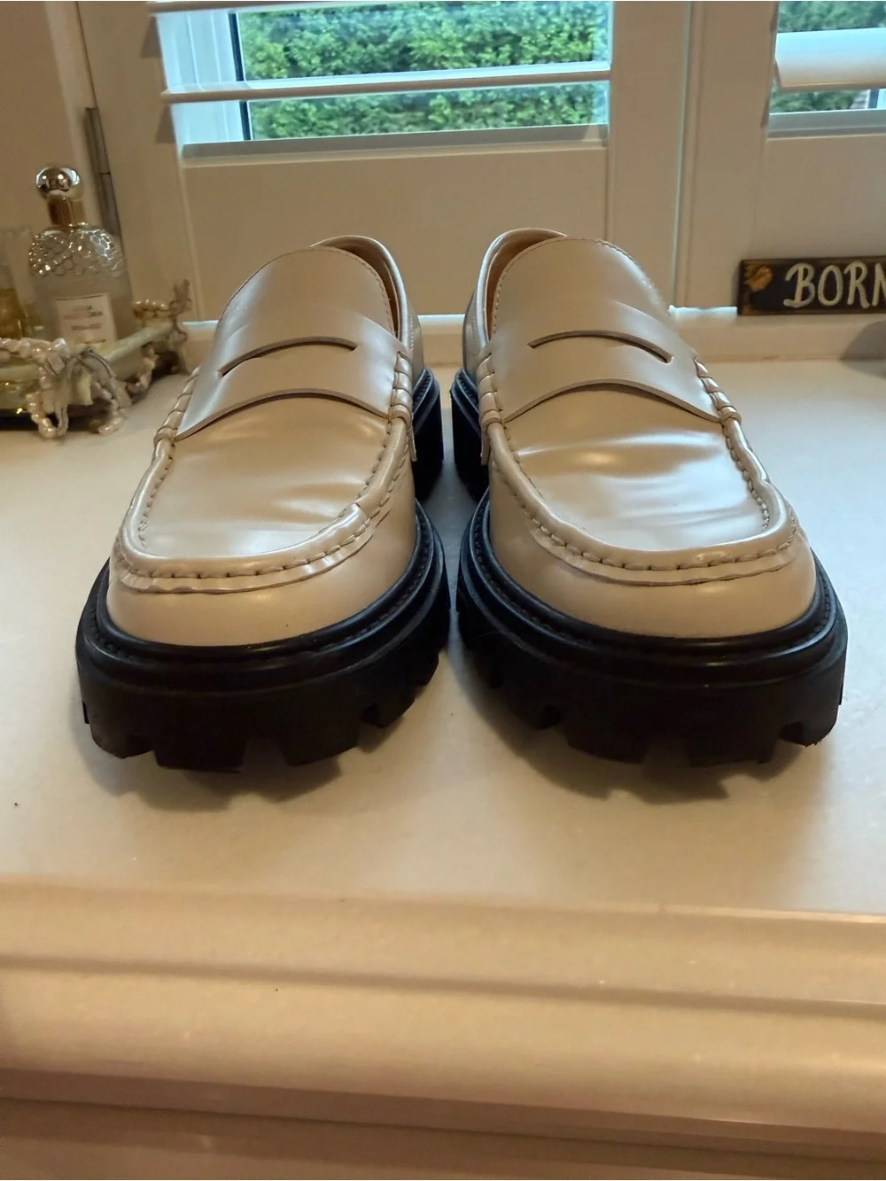 Tod’s Women’s White Leather Penny Loafers with Black Lug Sole - Picture 5 of 7